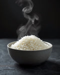 Steamed jasmine rice in a stoneware bowl