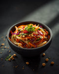Thai Salad with peanuts and chilli in a stoneware bowl
