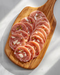 Mortadella slices with pistachio